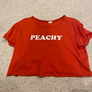Orange “peachy” crop top from Garage